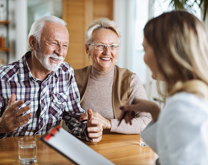 Couple talking to a receptionist