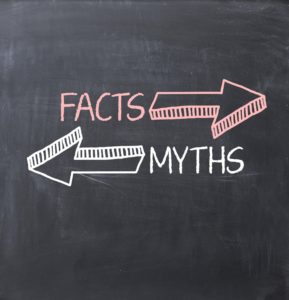 Myths vs facts chalkboard. Discover truth about dental implants