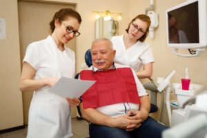 Senior man learning whether he is a good candidate for dental implants