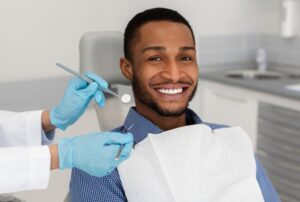 Man smiling after his teeth whitening treatment