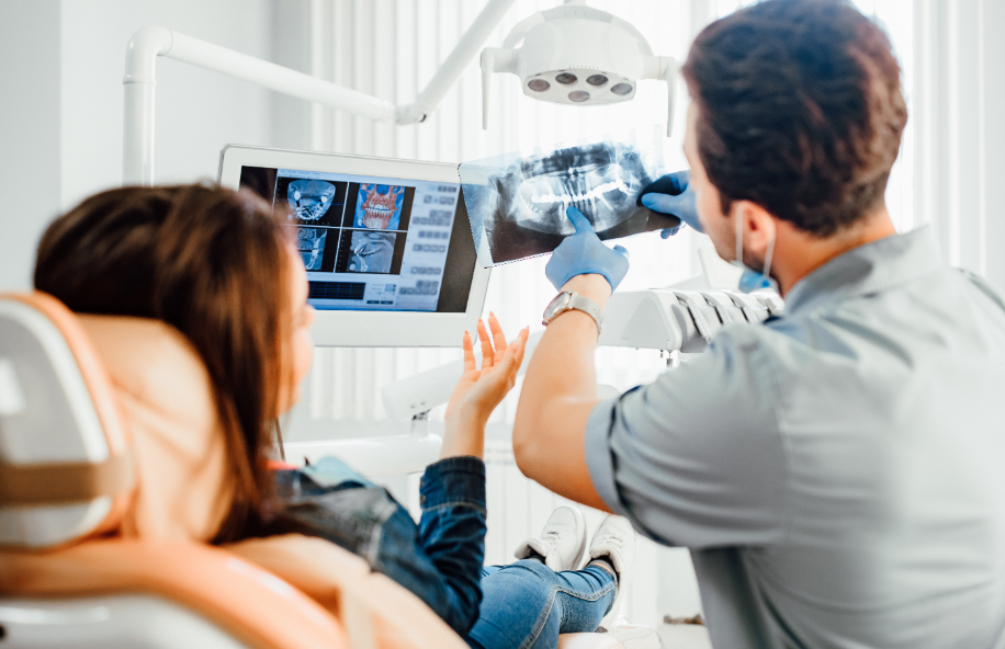 Dentist showing patient an x-ray